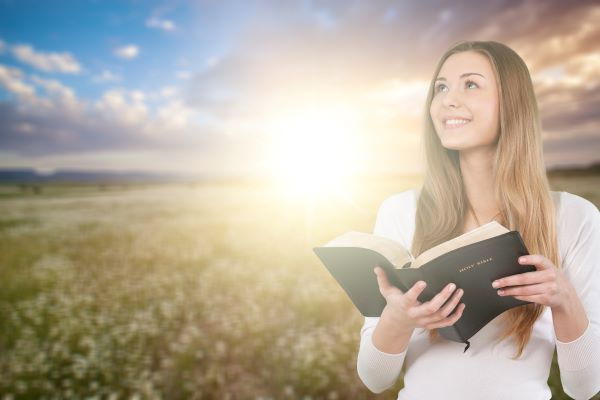 Happy Young Woman With Bible Blue Ridge Christian News