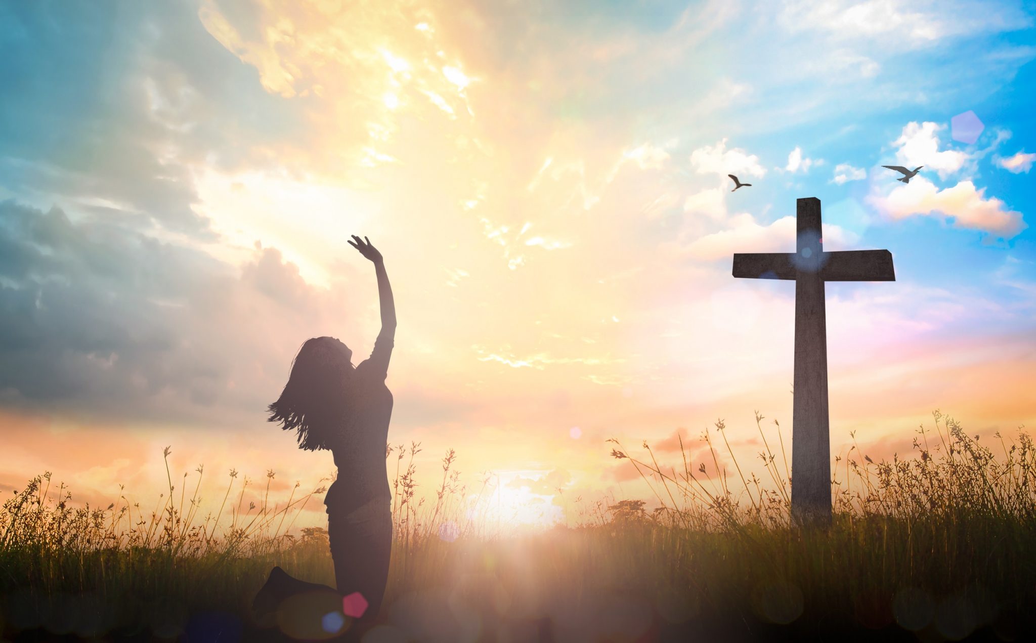 Woman Kneeling at cross - Blue Ridge Christian News